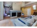 Spacious living room with a cozy fireplace, comfortable seating, and easy access to other living areas at 3404 Pasture View Ct, Charlotte, NC 28269