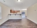 Inviting living room with wood floors and an open layout to the kitchen at 4149 River Run Cir, Hickory, NC 28602