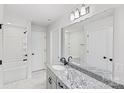 Bright bathroom with granite countertop, stylish fixtures, and a decorative mirror, designed for relaxation at 4175 River Run Cir, Hickory, NC 28602