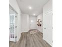 Bright entryway with hardwood floors and white trim offers a welcoming feel at 476 Dudley Dr, Fort Mill, SC 29715