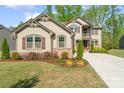 Beautiful two-story home featuring manicured landscaping and a welcoming facade at 513 Sandbar Pt, Lake Wylie, SC 29710