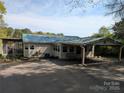 Charming single story home features a covered carport and screened in porch at 6778 Emerald Isle Dr, Sherrills Ford, NC 28673
