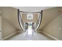 Stunning foyer featuring a split staircase and a chandelier over the entryway at 802 Capington Ln, Waxhaw, NC 28173
