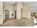Welcoming covered entrance with wooden deck, private doorway and an elevator at 921 Northeast Dr # 39, Davidson, NC 28036