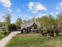 Beautiful brick home with lush landscaping, manicured lawn, and private driveway at 110 Devonshire Ln, Salisbury, NC 28146