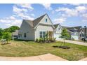 A beautiful home with a well-kept lawn and two-car garage in a Gathering-friendly neighborhood at 153 Pampas Pl, Statesville, NC 28625