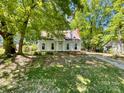 Quaint two-story home with a well-manicured front yard and inviting curb appeal at 2113 Killarney Pl, Charlotte, NC 28262
