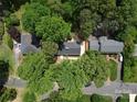 Aerial view showcasing the property's location surrounded by lush greenery and mature trees in a neighborhood setting at 2601 Pinewood Rd, Gastonia, NC 28054