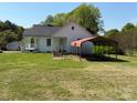 Quaint home featuring a front porch, wheelchair ramp, and a carport at 4787 Rock Barn Rd, Claremont, NC 28610