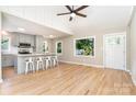 Open-concept kitchen and living area, complete with stainless appliances, quartz counters, and open floorplan at 504 N Hawthorne St, Mount Holly, NC 28120