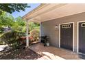 Covered front porch with a grill, propane tank, house number, and storm door at 6053 Treetop Ct, Charlotte, NC 28212