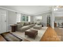 Spacious living room with a large sectional sofa and natural light at 621 Harper Davis Rd, Lake Wylie, SC 29710