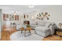 Bright living room with plush seating, hardwood floors, and decorative wall plates at 722 12Th Nw Ave, Hickory, NC 28601