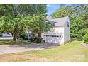 Spacious home with a two car garage and a well manicured yard at 10803 Gold Pan Rd, Charlotte, NC 28215