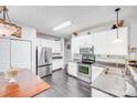 Bright kitchen featuring stainless steel appliances and ample cabinet space at 10803 Gold Pan Rd, Charlotte, NC 28215