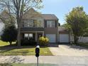 Beautiful home with a two-car garage and landscaped front yard, inviting curb appeal at 1104 Valley St, Statesville, NC 28677