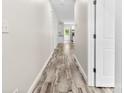 Inviting hallway boasting light-colored walls and beautiful, durable wood-look flooring at 1301 Marble St, Charlotte, NC 28208