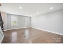 Bright living area boasting hardwood floors and a staircase at 1592 Farmington Hills Dr, Conover, NC 28613