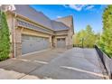 Three-car garage with additional parking and basketball hoop at 17909 Golden Meadow Ct, Davidson, NC 28036