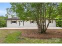 Charming brick ranch features lovely landscaping, a brick chimney, and a freshly painted exterior at 1904 27Th Avenue Ne Dr, Hickory, NC 28601