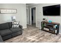 Cozy living room showcases wood-look floors, modern decor, and a comfortable gray sofa at 2122 Hope Dr, Rock Hill, SC 29730