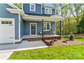 Inviting front porch with seating area, perfect for enjoying the outdoors at 2668 Polo Ln, Maiden, NC 28650