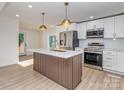 Newly renovated kitchen featuring an island and modern stainless steel appliances at 2717 Springway Dr, Charlotte, NC 28205