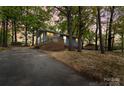 Charming single-story home features a new front porch, blue siding, and mature trees, offering a peaceful setting at 313 Villa St, Kannapolis, NC 28083