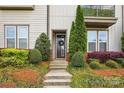 Inviting front entrance with a decorative wreath, manicured landscaping, and a well-maintained walkway at 3216 Moss Ln, Charlotte, NC 28206