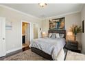 Well-lit bedroom features a queen bed, contemporary decor, an ensuite, and a closet at 3216 Moss Ln, Charlotte, NC 28206