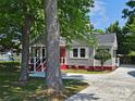Charming single-story home with a well-manicured front yard and inviting curb appeal at 3824 Freedom Dr, Charlotte, NC 28208