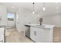 Bright, open kitchen with stainless steel appliances and center island at 405 Durham Ave, Statesville, NC 28677