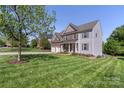 Beautiful two-story home with a well-maintained lawn and attractive landscaping at 5035 Terrier Ln, Fort Mill, SC 29707