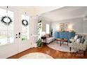 Light-filled living room with hardwood floors, stylish furnishings, and elegant decor at 548 Fairwoods Dr, Huntersville, NC 28078