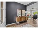 Inviting entryway with hardwood floors, stylish console table, decor, and a view into the living room at 8018 Green Heron Ct, Belmont, NC 28012