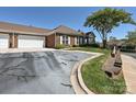 Home exterior features a two-car garage and lengthy driveway at 8274 Windsor Ridge Dr, Charlotte, NC 28277