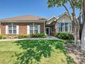 Charming brick home featuring well-maintained landscaping and a welcoming entrance at 8274 Windsor Ridge Dr, Charlotte, NC 28277