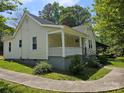 Well-maintained home with a welcoming front porch and manicured lawn, providing great curb appeal at 83 Tribune Sw Ave, Concord, NC 28025