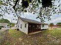 A renovation property, awaiting transformation, showcasing structural elements and potential at 104 E Church St, Dallas, NC 28034
