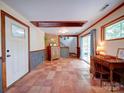 Spacious basement featuring tile flooring, a desk, and a walkout to the exterior at 110 Dutch Creek Rd, Rockwell, NC 28138