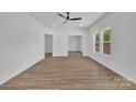 Spacious living room featuring modern flooring, neutral walls and bright windows at 1119 Stanback Rd, Chester, SC 29730