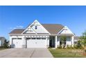 Inviting home showcasing the three car garage and craftsman-style architecture on a sunny day at 13279 Arnold Palmer Cir # 867, Lancaster, SC 29720