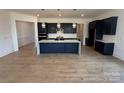 Modern kitchen with sleek cabinetry, a spacious center island, and stylish pendant lighting at 13279 Arnold Palmer Cir # 867, Lancaster, SC 29720