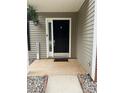 Inviting front door with decorative hardware and a well-maintained entrance at 15003 Jerpoint Abby Dr, Charlotte, NC 28273