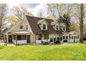 Spacious backyard featuring a patio with outdoor seating and grilling area and lush green grass at 16 Catawba Ridge Ct, Clover, SC 29710