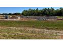 Foundation of a new construction home being built on a verdant, expansive lot at 169 Trinity Ct, Salisbury, NC 28147