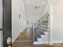Inviting home entrance boasts soaring ceilings, wood floors, staircase, and abundant natural light at 3308 Watkins Rd, Monroe, NC 28110