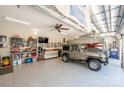 Spacious garage with epoxy floors, car lift, work bench and car memorabilia at 4594 N Wynswept Dr, Maiden, NC 28650