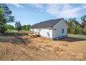 New construction home showcasing rear exterior with wooden deck and classic siding at 504 Christopher Ln, Chester, SC 29706