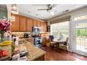 Bright kitchen featuring wood cabinets, granite countertops, stainless appliances, and eat-in breakfast nook at 512 Park View Dr, Belmont, NC 28012